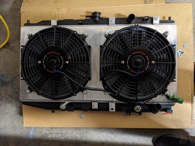Mishimoto fan shroud mounted on the OEM radiator